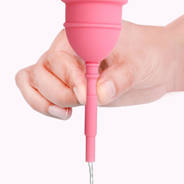 Woman holding a silicone menstrual cup sterilizer for feminine hygiene